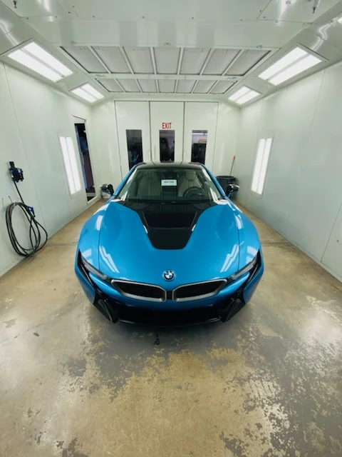 Blue BMW in the paint booth at Anthony’s Auto Craft