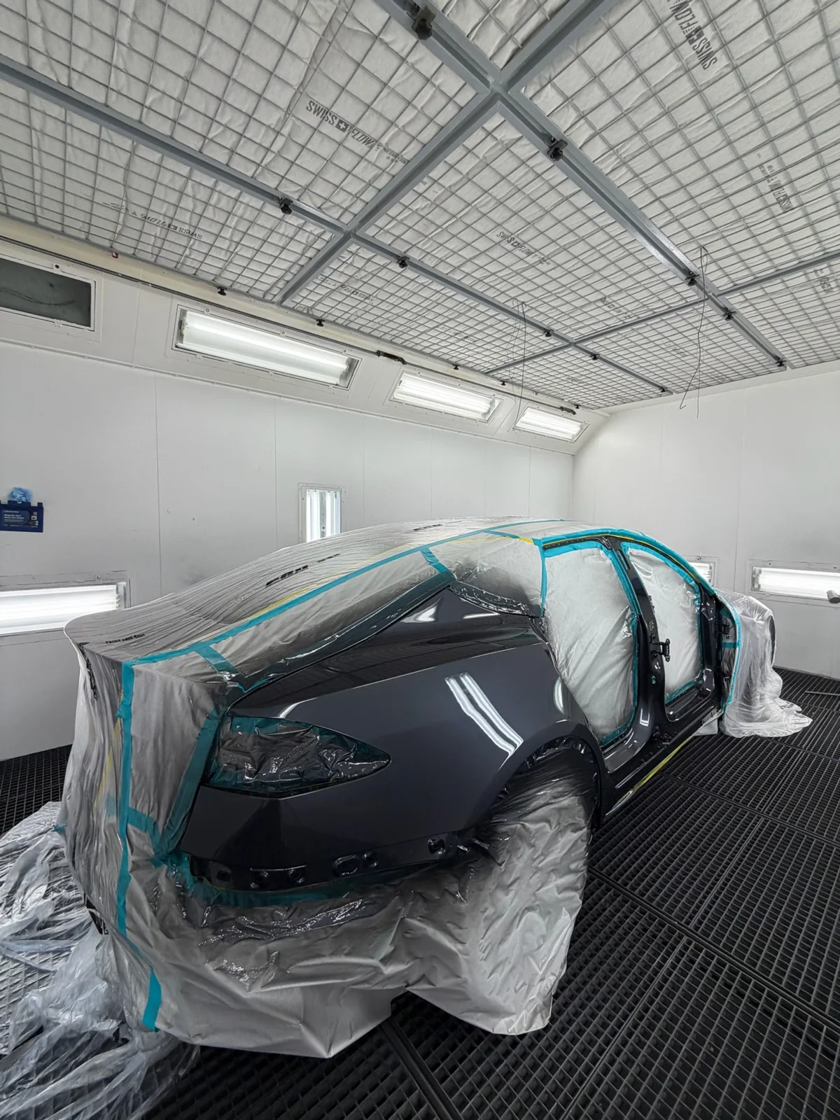 Paint refinishing in professional booth